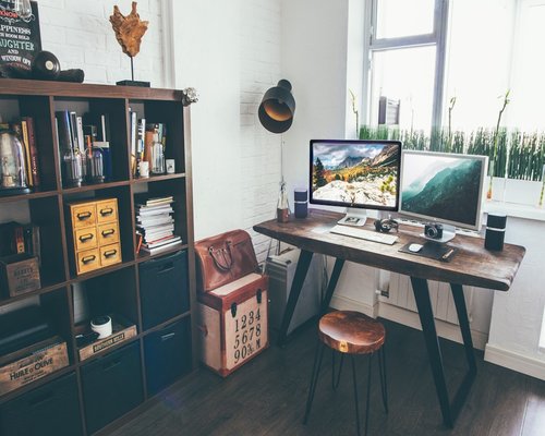 Organized workspace with external monitor and soft lighting